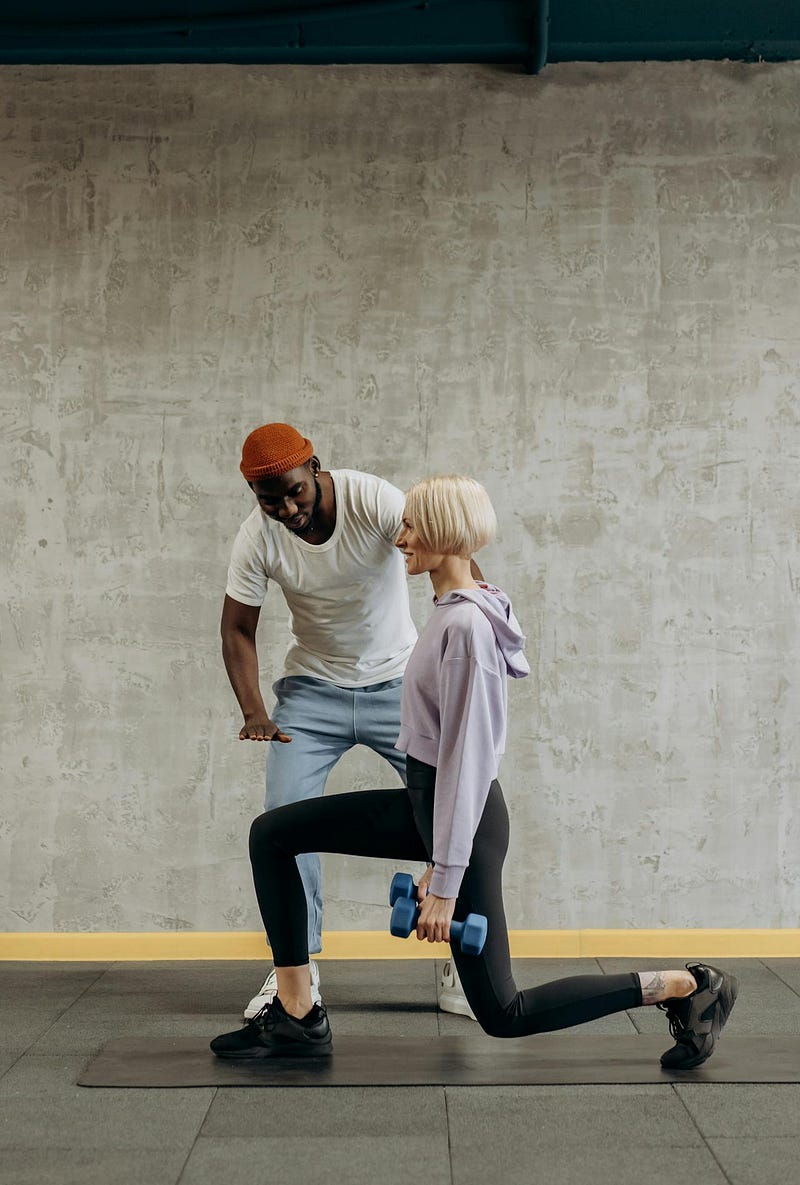 Person performing lunges with dumbbells