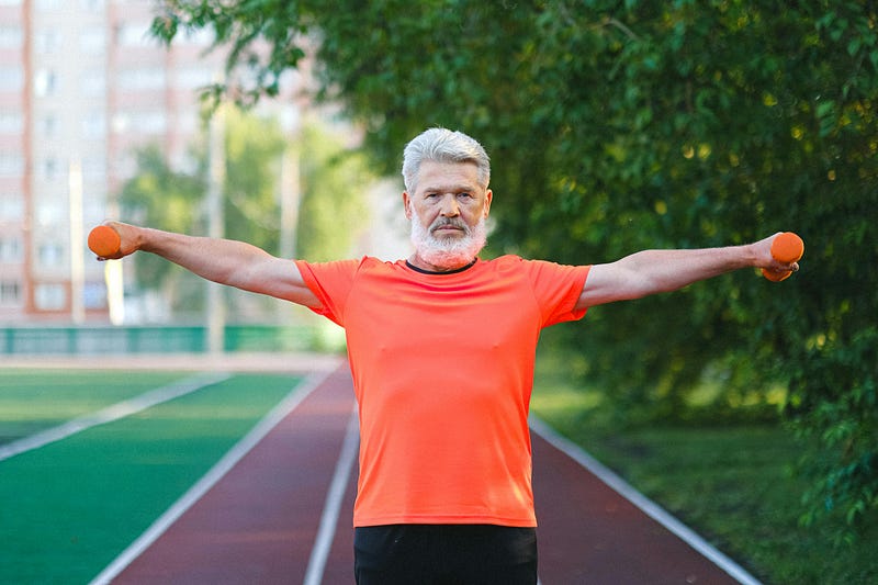 Individual performing lateral shoulder raises