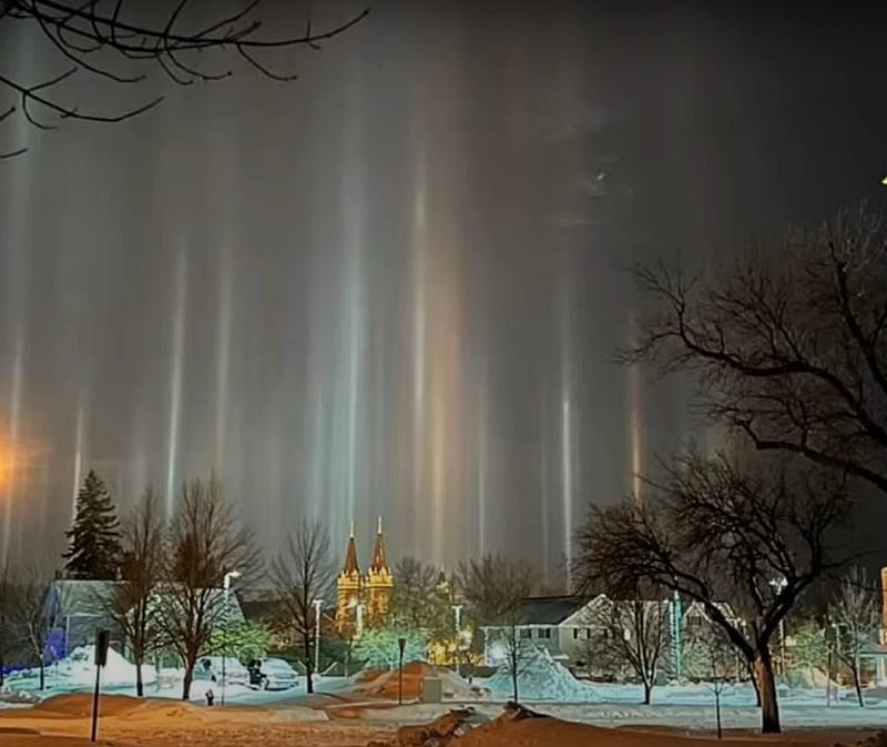 Light pillars illuminating the night sky