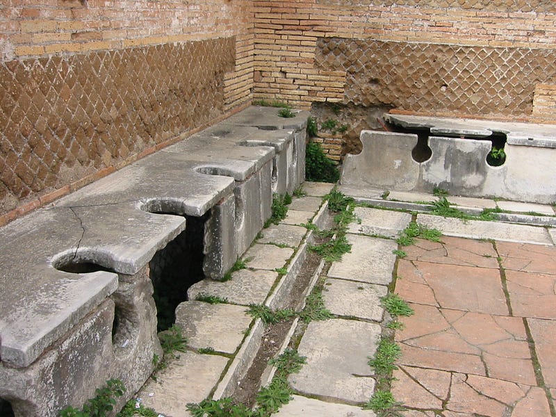 Remnants of a Roman public toilet in Ostia, Italy