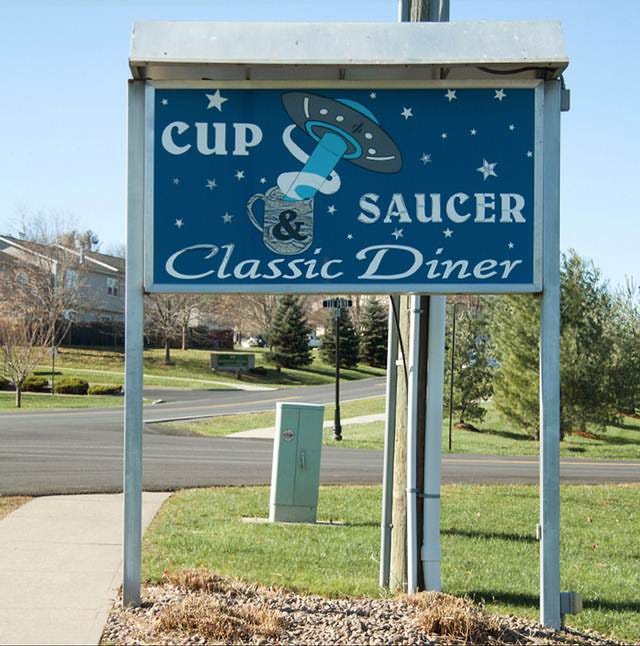 Local UFO historian Butch surrounded by UFO memorabilia