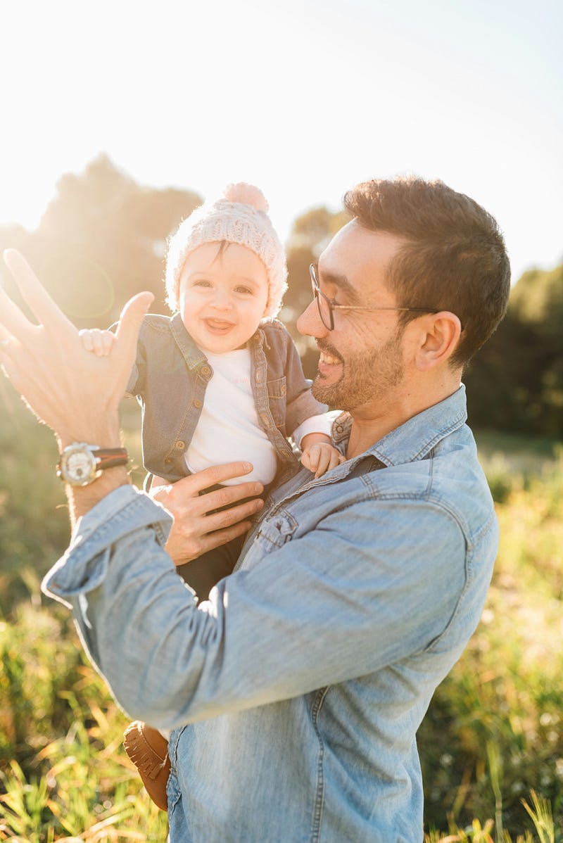 Engaged father playing with his child